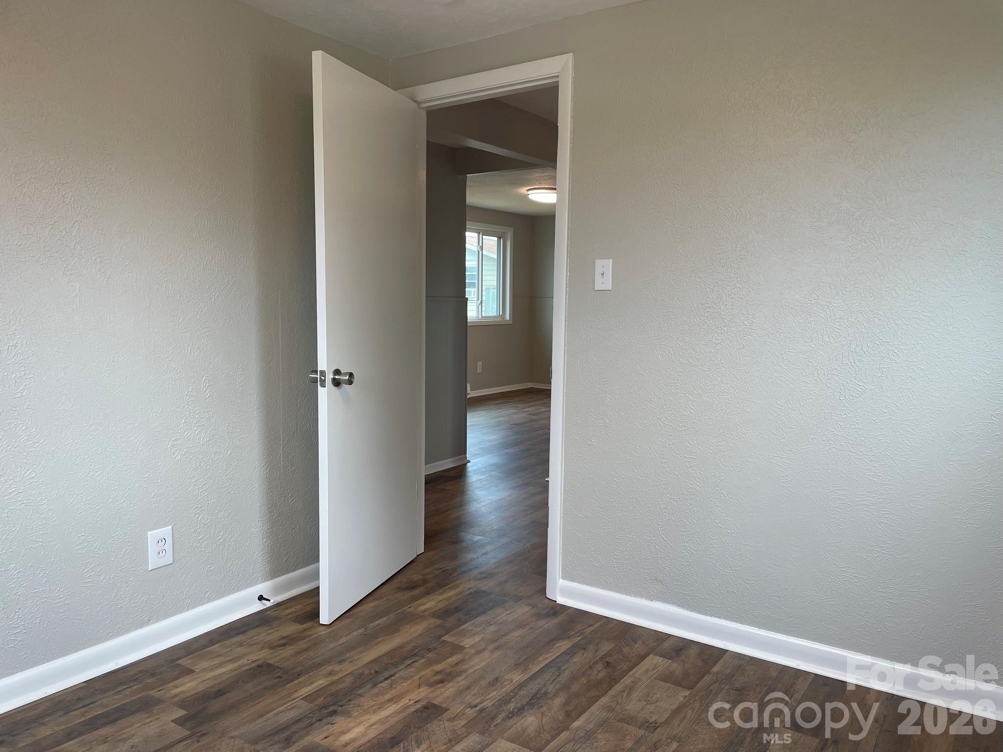 7686 Shoupes Grove Church Road Hickory, NC 28602 - Photo 32 of 36 an empty room with wooden floor & closet