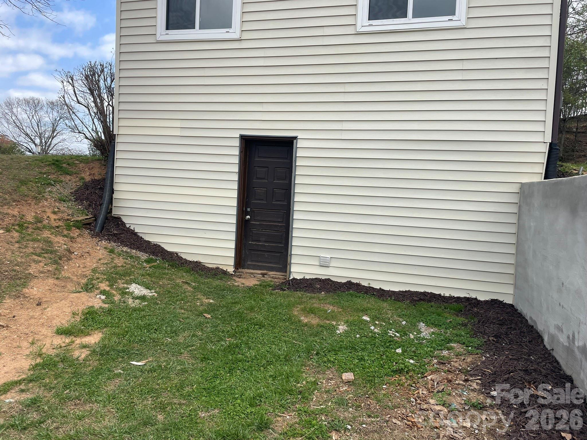 7686 Shoupes Grove Church Road Hickory, NC 28602 - Photo 33 of 36 a view of a white house with a yard