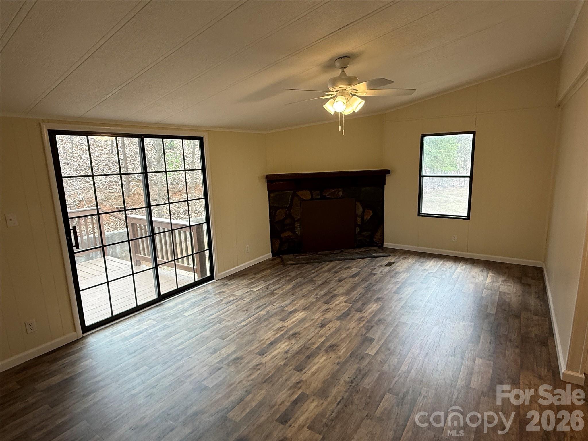 7686 Shoupes Grove Church Road Hickory, NC 28602 - Photo 7 of 36 a view of an empty room with wooden floor and a window