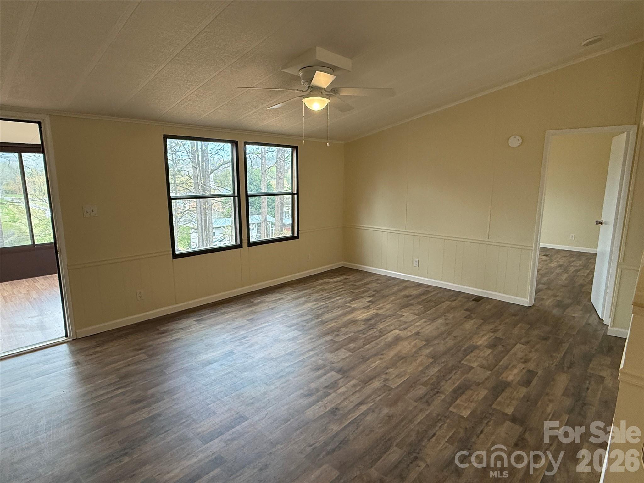7686 Shoupes Grove Church Road Hickory, NC 28602 - Photo 10 of 36 an empty room with wooden floor and windows