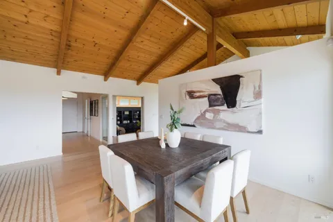 a view of a balcony with yard