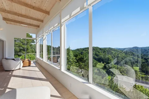 a balcony with wooden floor and outdoor space