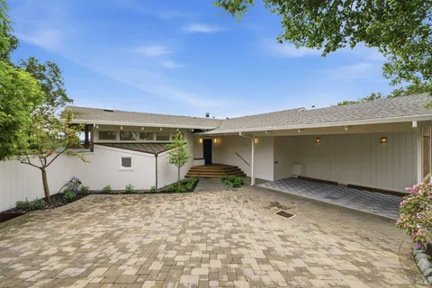 a view of a backyard of the house