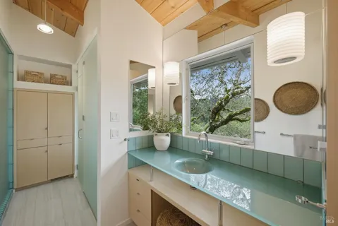 a white bath tub sitting next to a window