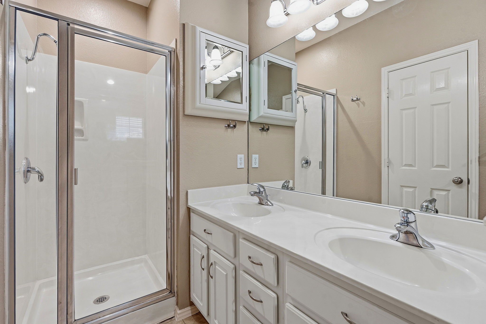1900 Scofield Ridge Parkway, Unit 3002 Austin, TX 78727 - Photo 13 of 23 a bathroom with double vanity sink and a mirror
