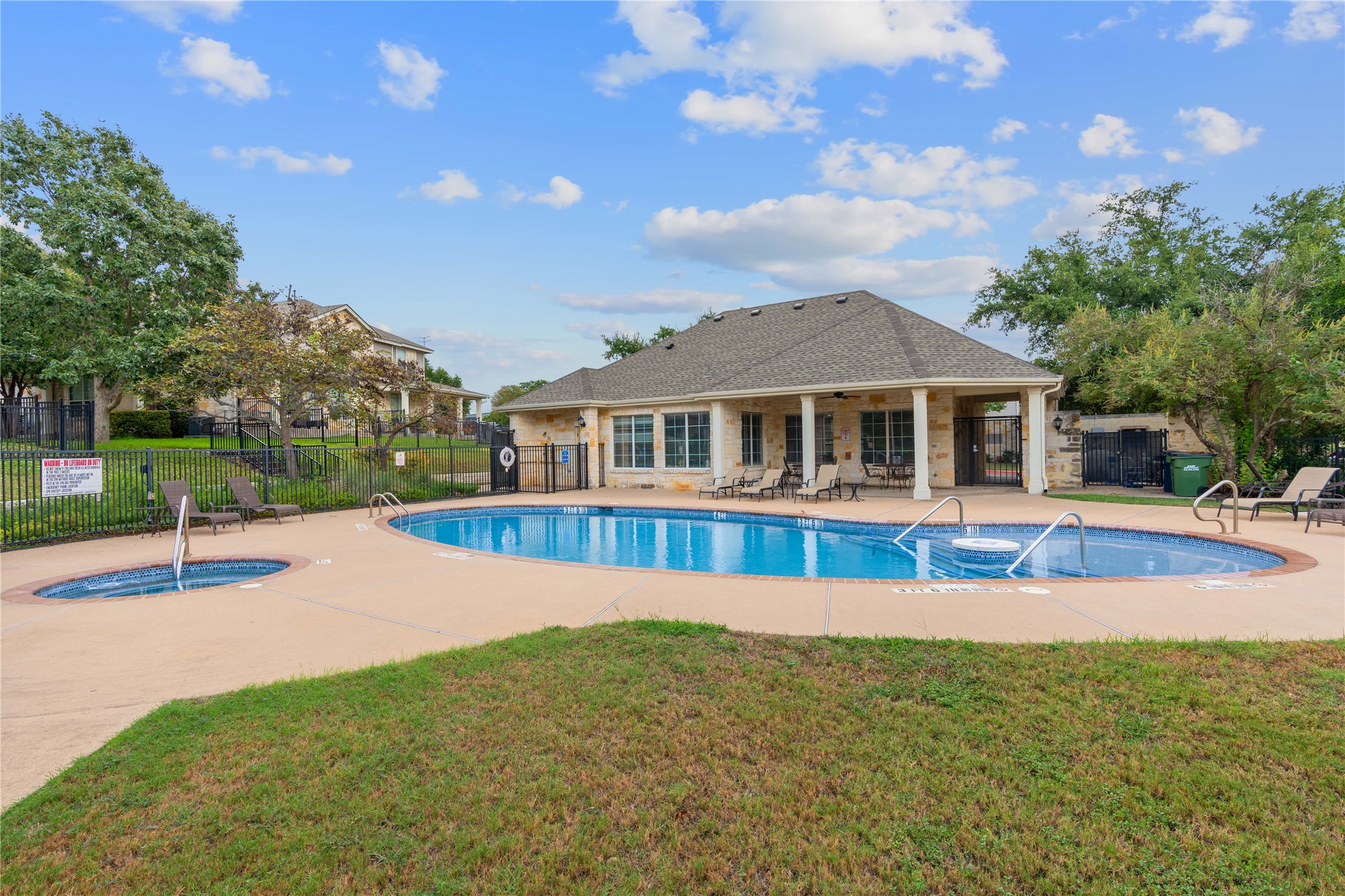 1900 Scofield Ridge Parkway, Unit 3002 Austin, TX 78727 - Photo 22 of 23 a view of pool with umbrella and trees in the background