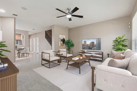 a living room with furniture and a table