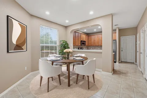 a view of a dining room with furniture window and outside view