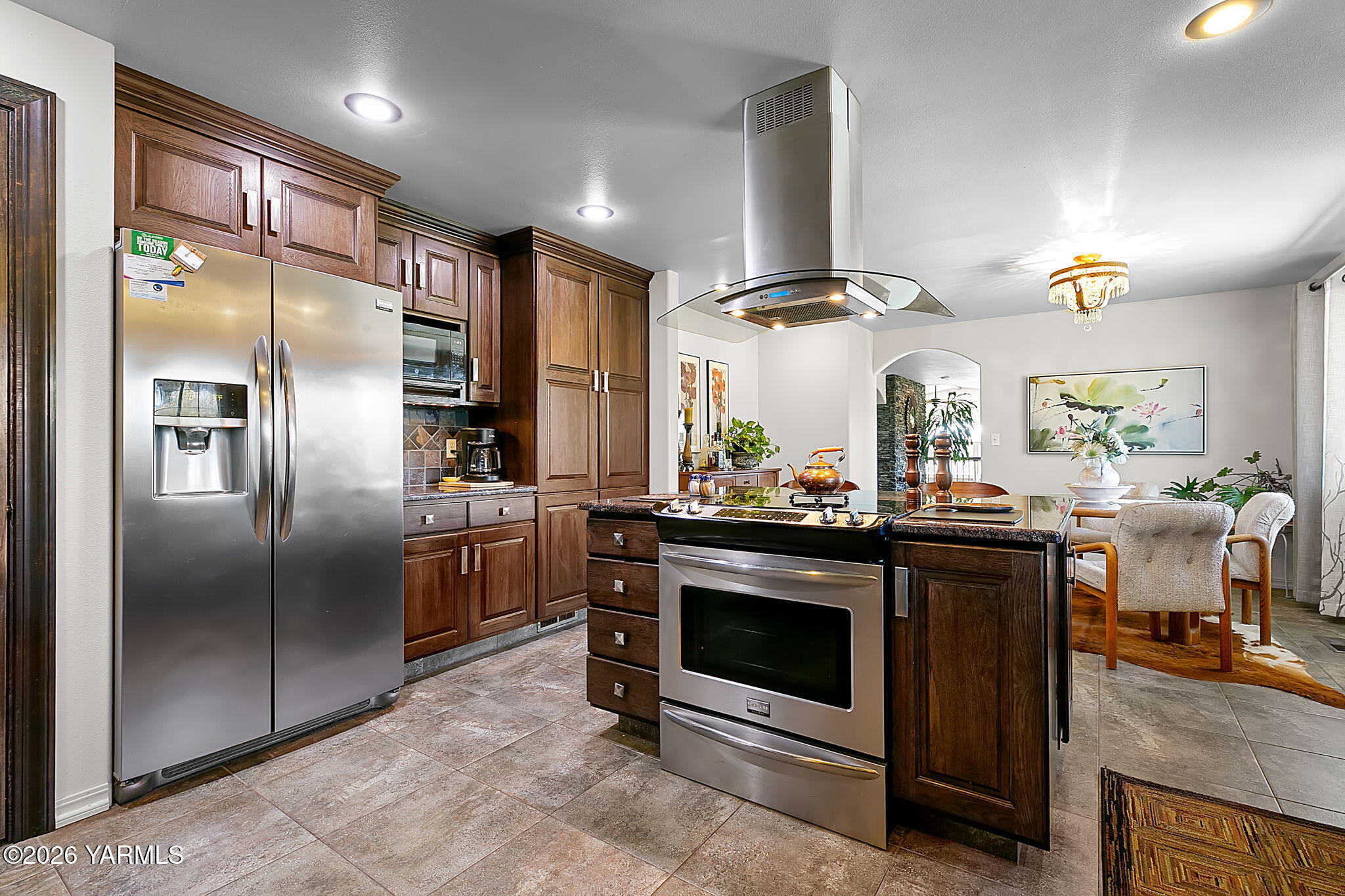 10161 North Wenas Road Selah, WA 98942 - Photo 16 of 48 a kitchen with stainless steel appliances granite countertop a stove a refrigerator and a refrigerator