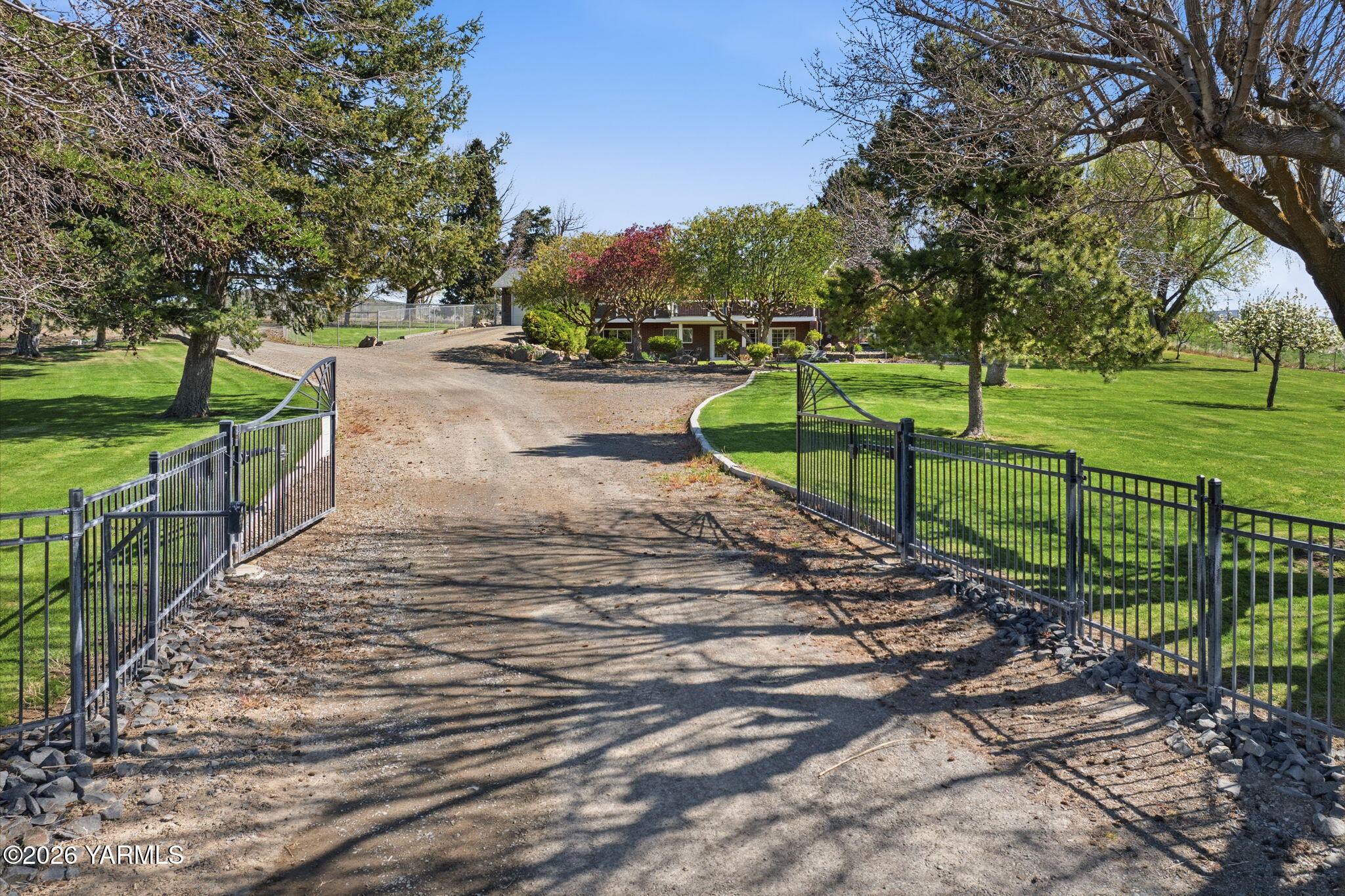 10161 North Wenas Road Selah, WA 98942 - Photo 2 of 48 a view of a park with swings and a lake view