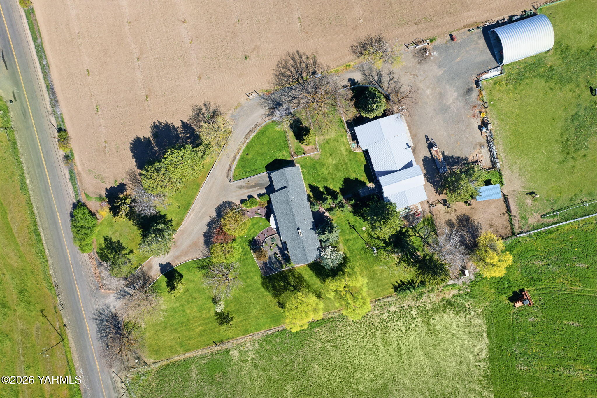 10161 North Wenas Road Selah, WA 98942 - Photo 48 of 48 an aerial view of a house with a yard and plants