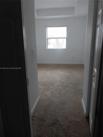 a view of a hallway with staircase