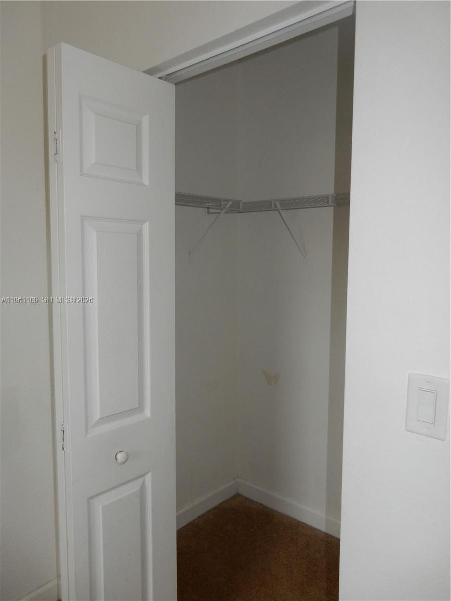 3467 West 89th Terrace Hialeah, FL 33018 - Photo 14 of 33 a view of an empty walk in closet