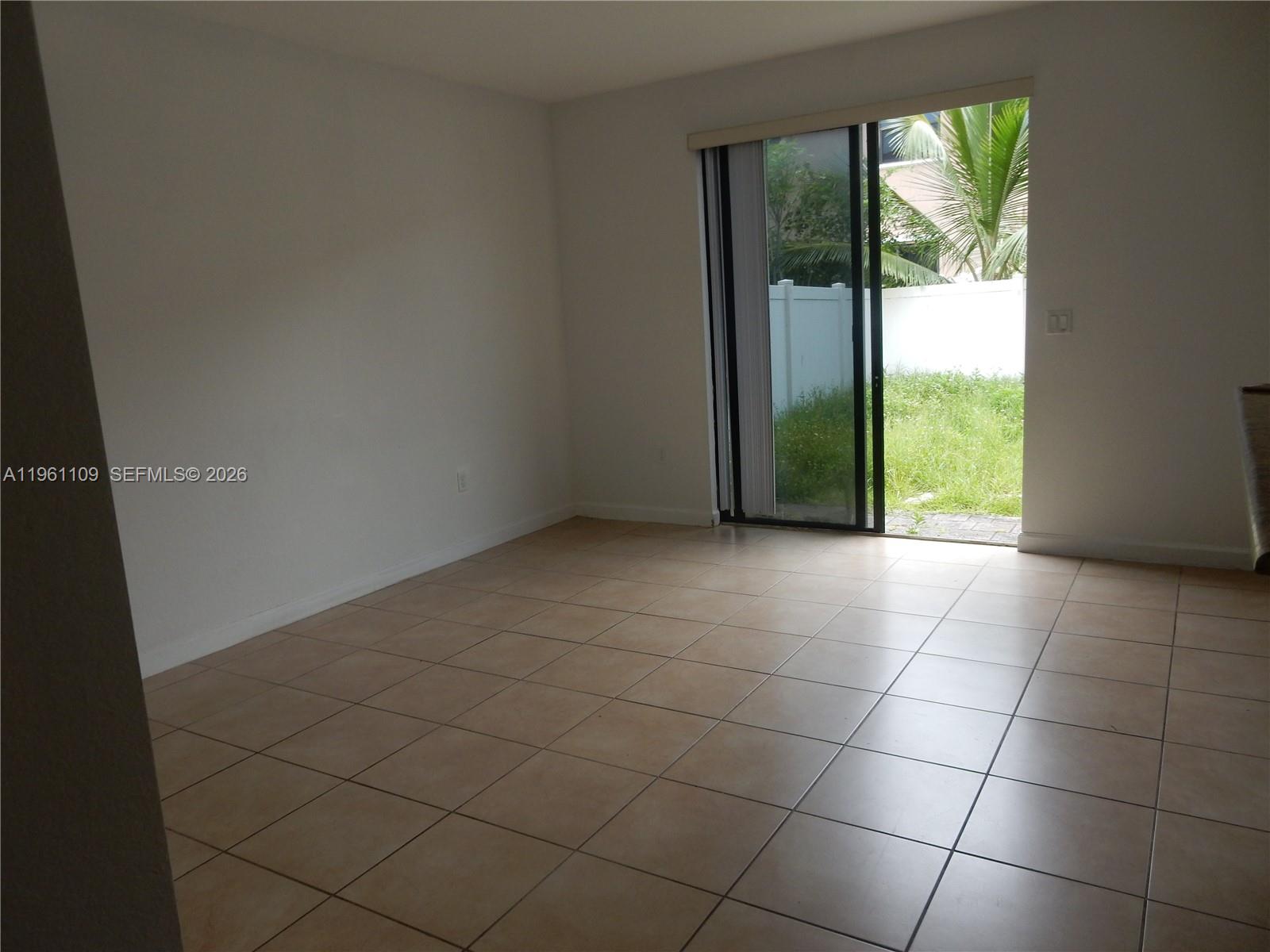 3467 West 89th Terrace Hialeah, FL 33018 - Photo 26 of 33 a view of an empty room with a window