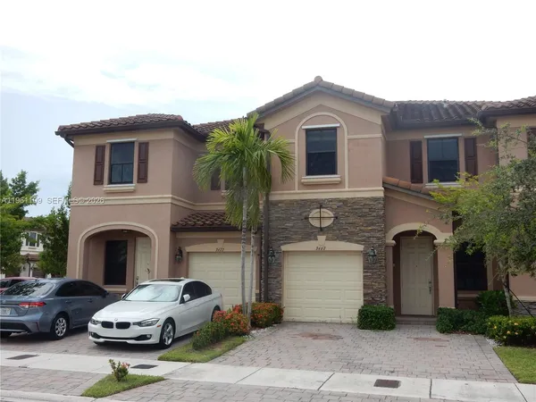a front view of a house with garage