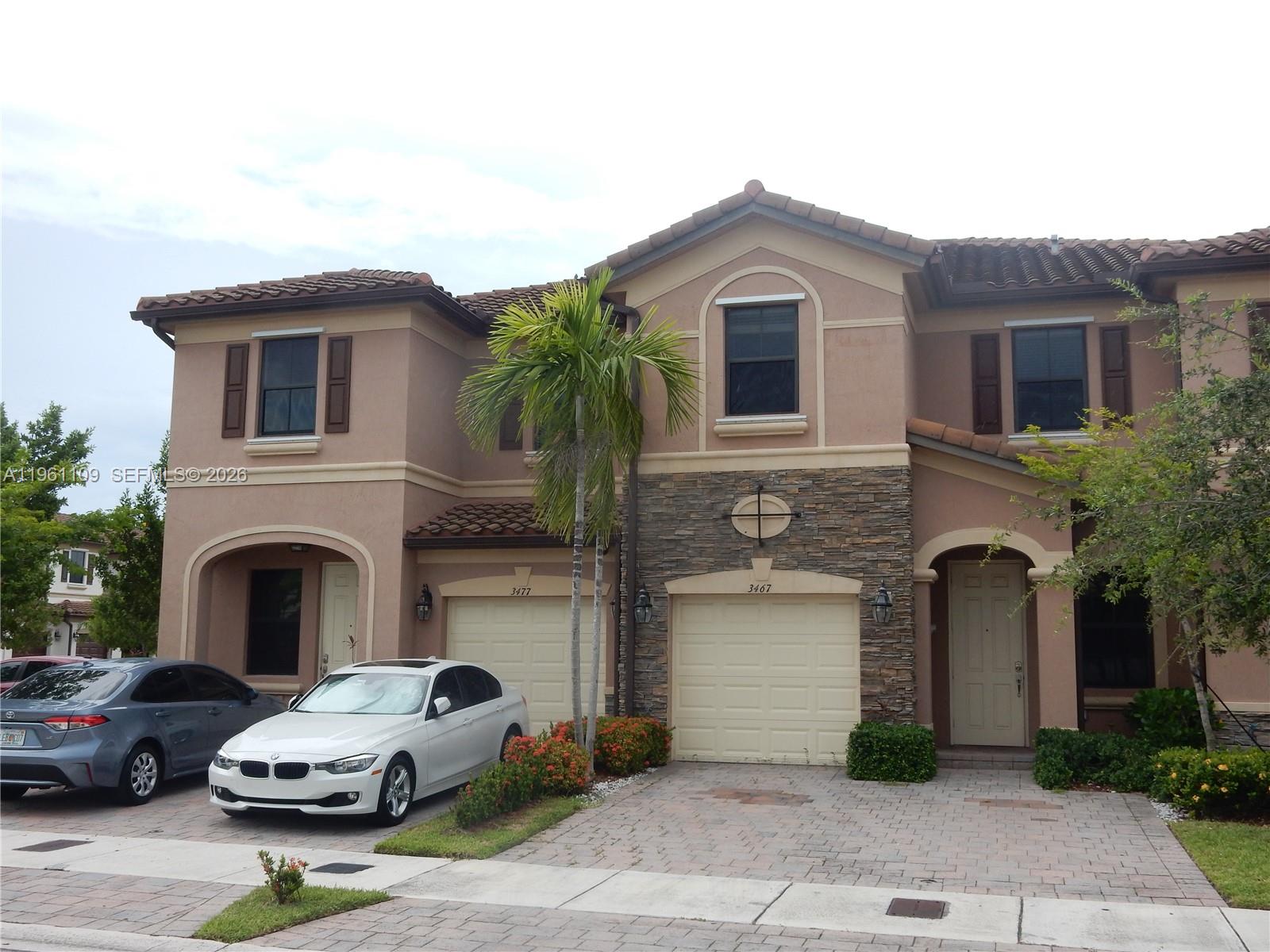3467 West 89th Terrace Hialeah, FL 33018 - Photo 5 of 33 a front view of a house with parking space