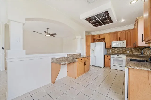 a kitchen with sink cabinets and window