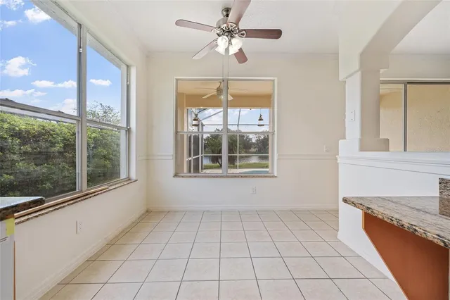 an empty room with closet and windows