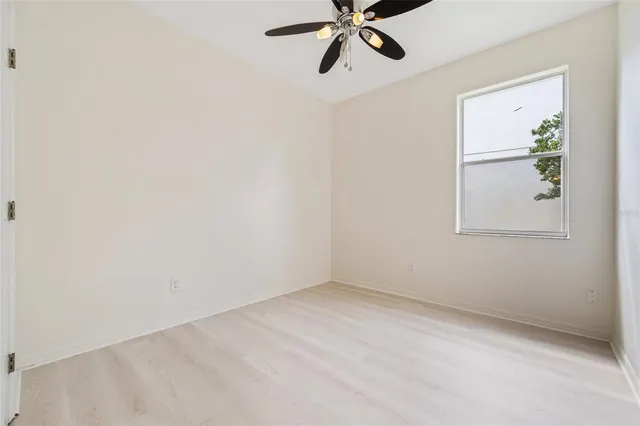 a spacious bathroom with double vanity a mirror a bathtub and double vanity