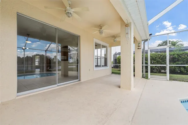 a view of a white building with a swimming pool