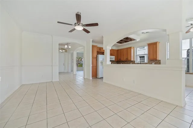 a large kitchen with kitchen island granite countertop a large window