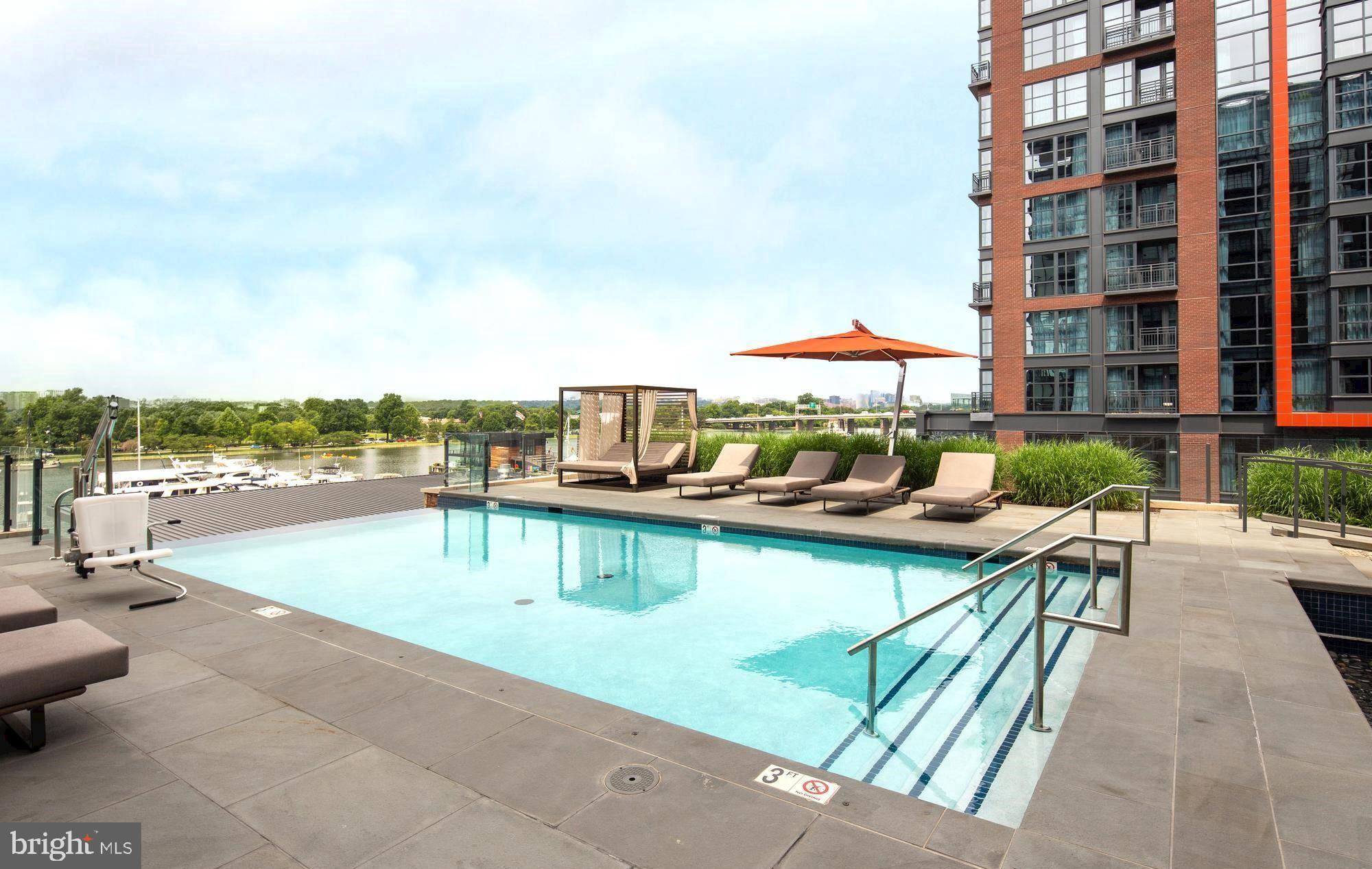45 Sutton Square Southwest, Unit 1120 Washington, DC 20024 - Photo 24 of 39 Take in water views relaxing by the pool