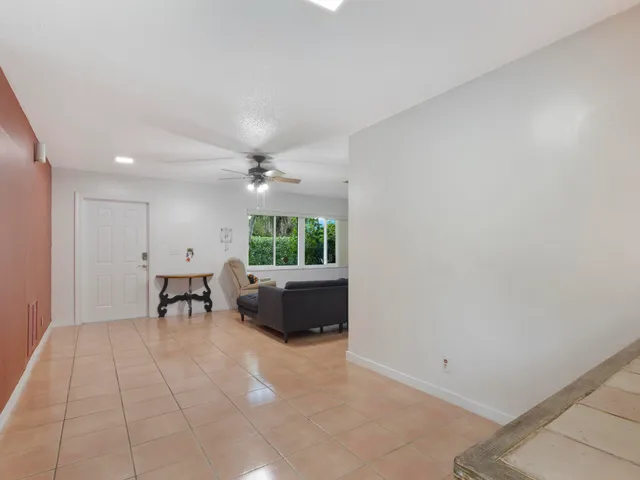 an empty room with furniture and a window