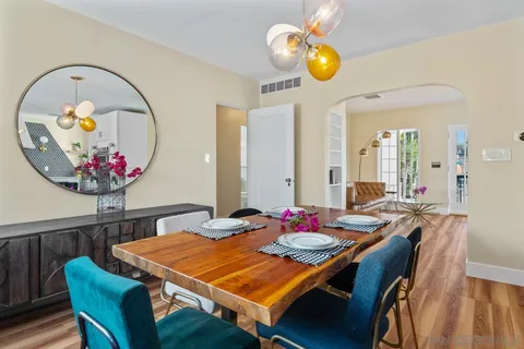 a kitchen with stainless steel appliances a stove refrigerator and cabinets