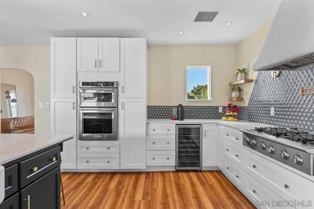 a bedroom with bed and wooden floor