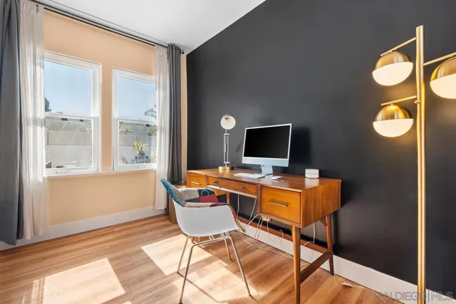 a kitchen with granite countertop a refrigerator stove and sink