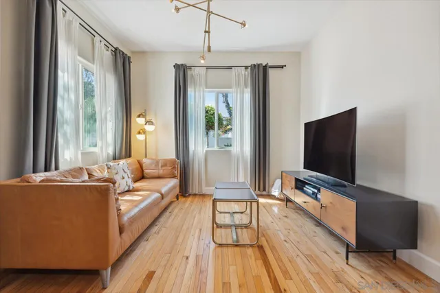 a kitchen with a sink a stove and a refrigerator