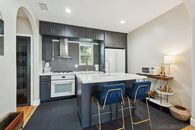 a bathroom with a toilet sink and shower