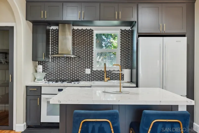 a bedroom with a bed mirror and a window