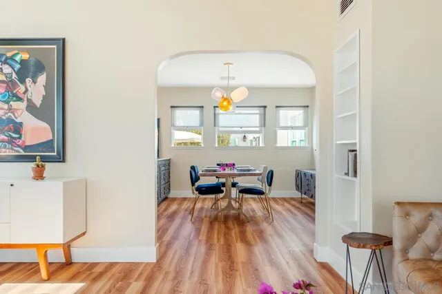 a view of a dining room with furniture window and wooden floor