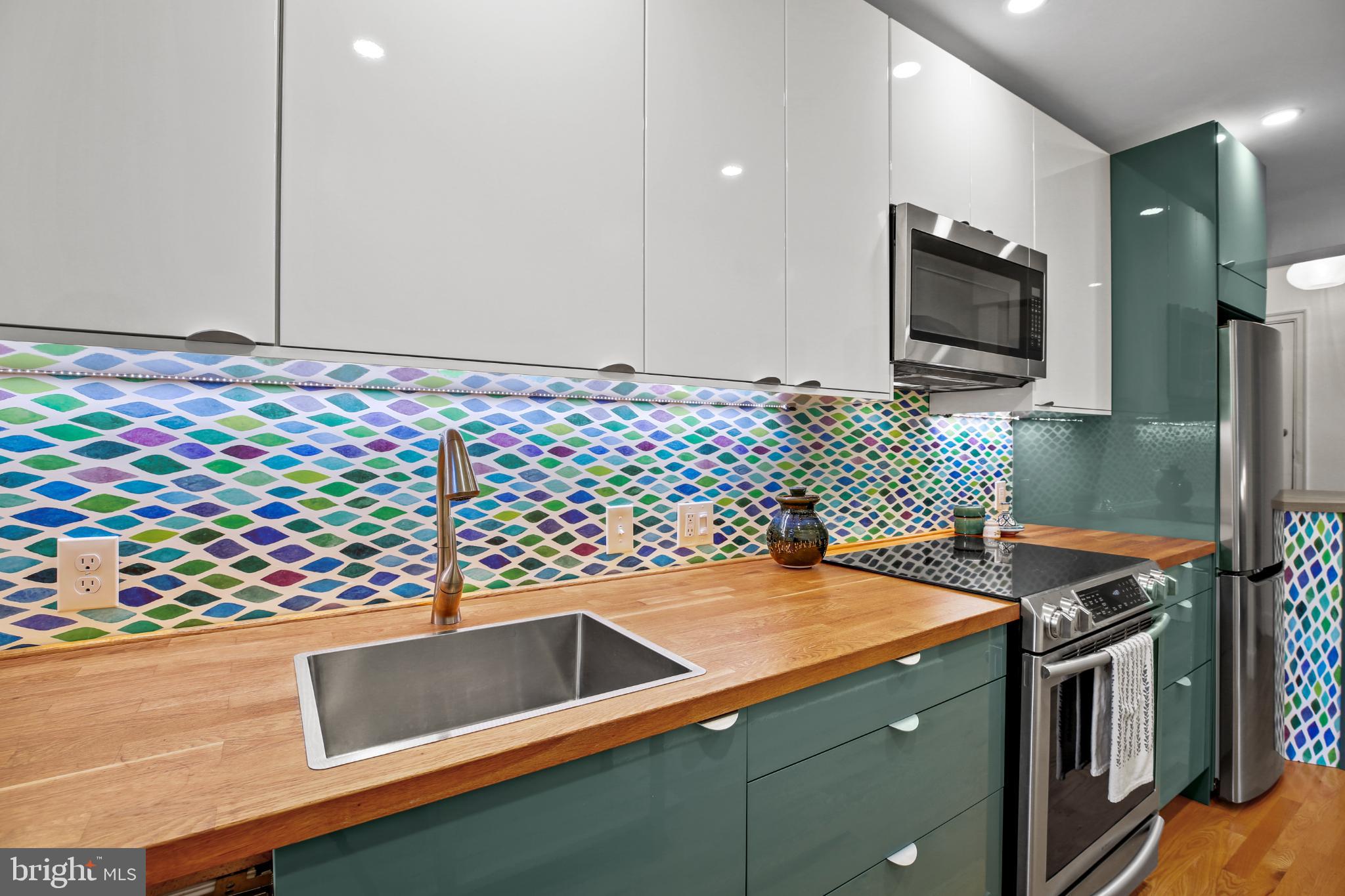 318 Rhode Island Avenue Northeast, Unit 101 Washington, DC 20002 - Photo 12 of 33 a kitchen with a sink and a stove top oven