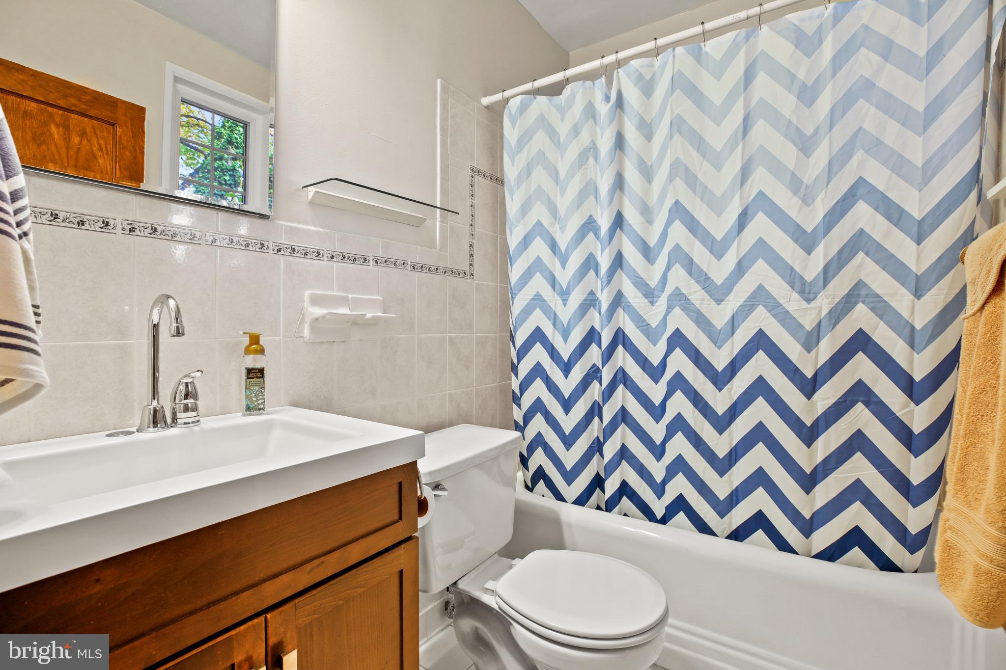 318 Rhode Island Avenue Northeast, Unit 101 Washington, DC 20002 - Photo 18 of 33 a bathroom with a sink toilet and shower