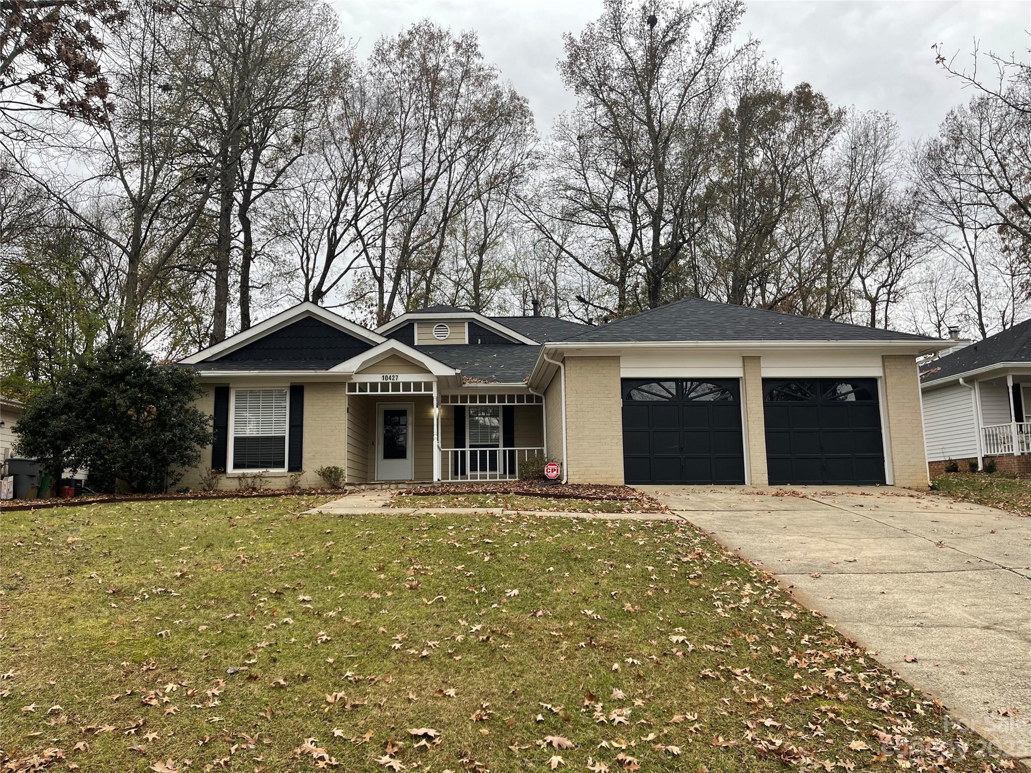 10427 Fairway Ridge Road Charlotte, NC 28277 - Photo 1 of 21 a front view of a house with a yard