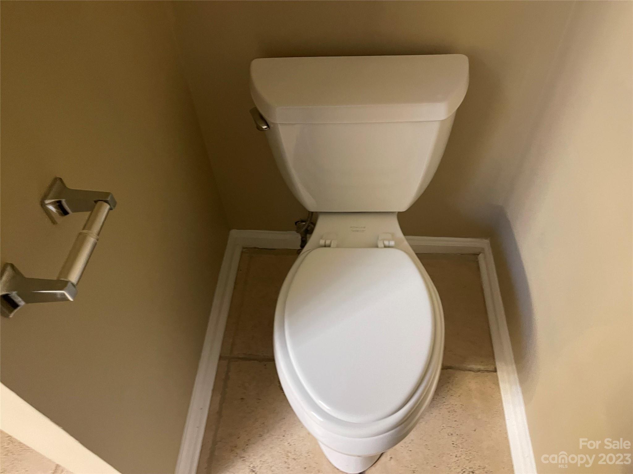 10427 Fairway Ridge Road Charlotte, NC 28277 - Photo 13 of 21 a close view of a toilet in a bathroom