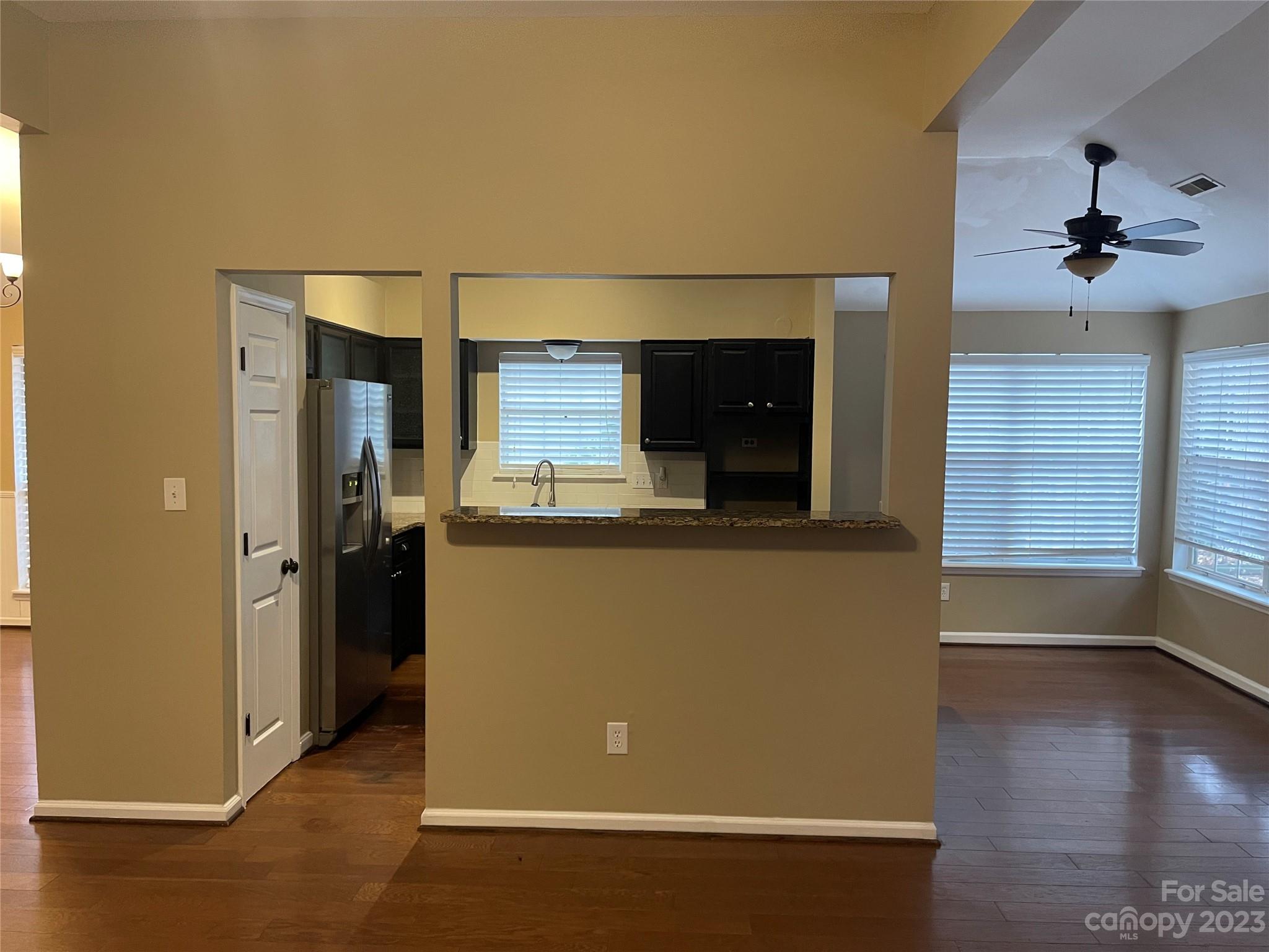 10427 Fairway Ridge Road Charlotte, NC 28277 - Photo 5 of 21 a view of a kitchen from the hallway