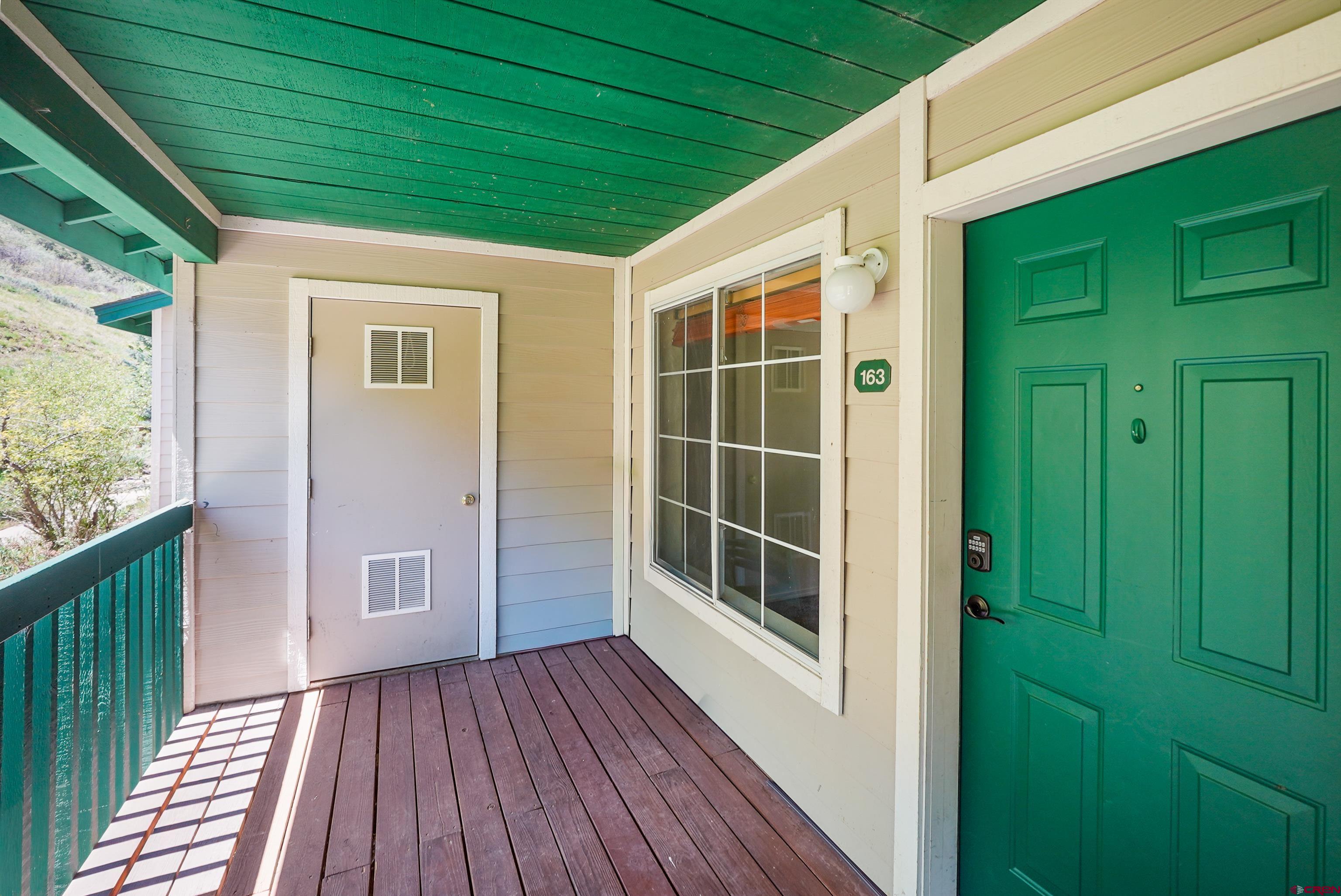 1100 Goeglein Gulch Road, Unit 163 Durango, CO 81301 - Photo 6 of 23 a view of house with deck and wooden floor