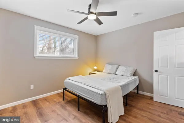 a room that has a bed and a table in it