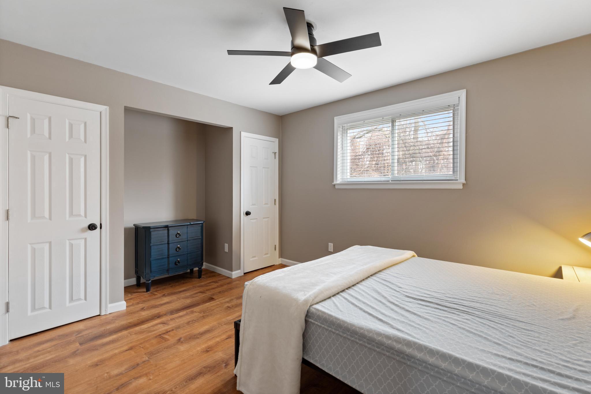 331 Ripka Street, Unit 1 Philadelphia, PA 19128 - Photo 8 of 8 a bedroom with a bed closet and wooden floor