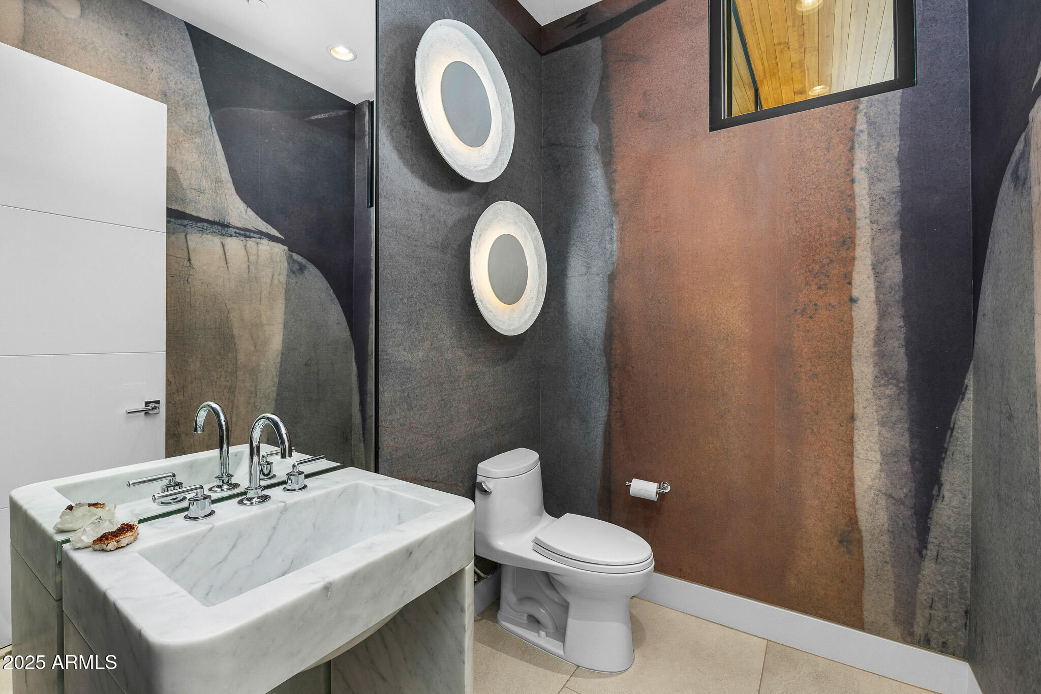 6149 East Indian Bend Road Paradise Valley, AZ 85253 - Photo 18 of 77 a bathroom with a toilet sink and mirror