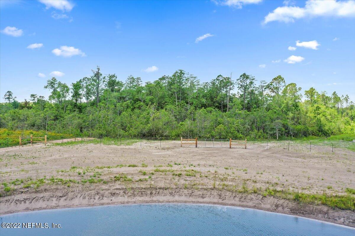 17444 Co Road Bryceville, FL 32009 - Photo 12 of 17 a backyard of a house with a yard and trampoline