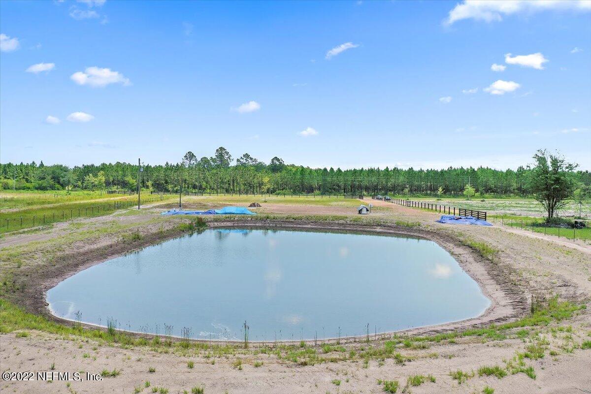 17444 Co Road Bryceville, FL 32009 - Photo 13 of 17 a view of a lake with a big yard