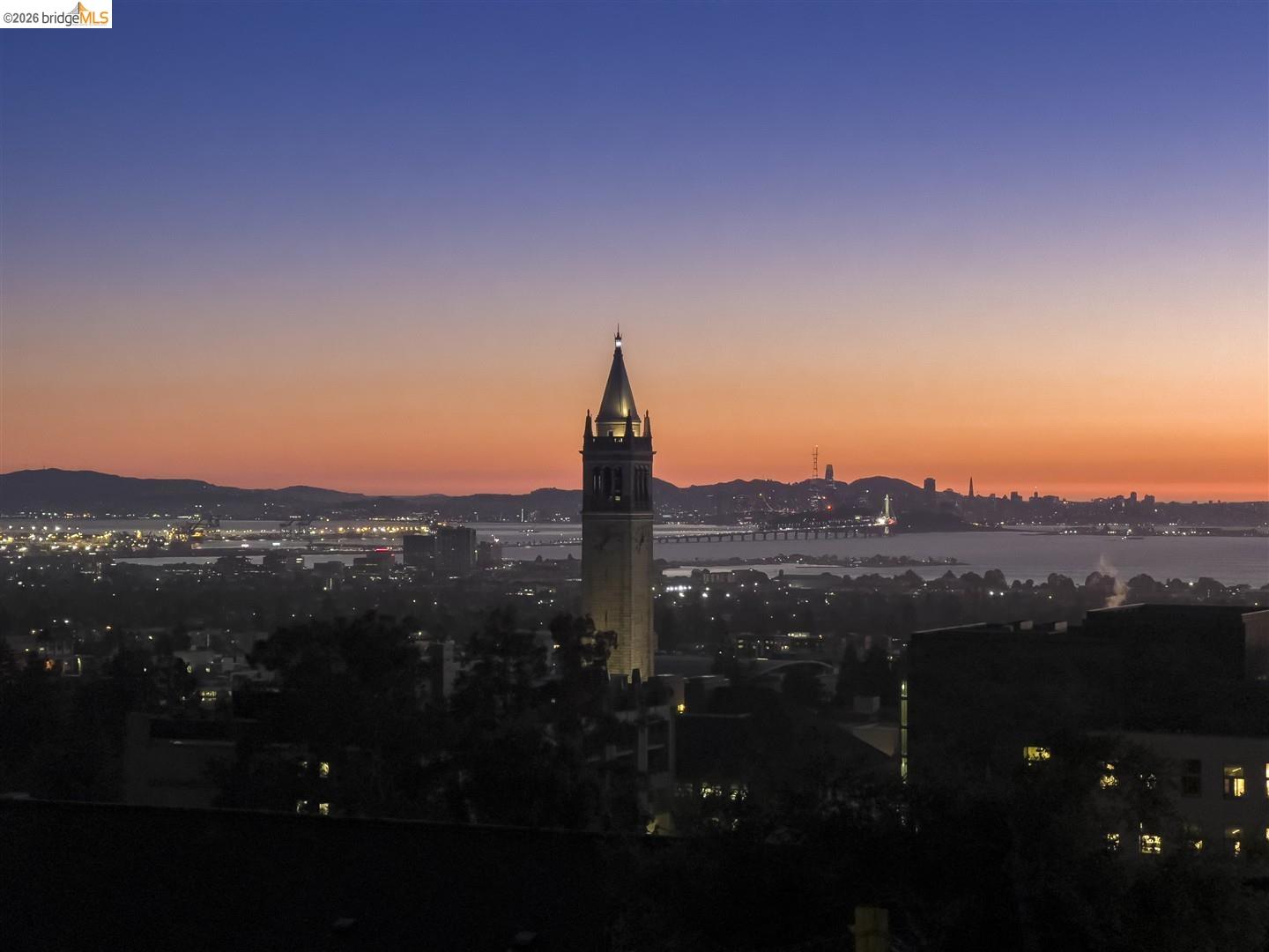 1668 Arch Street Berkeley, CA 94709 - Photo 67 of 78 Expansive cityscape with a prominent tower and illuminated distant skyline