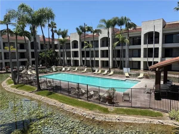 front view of a house with swimming pool and porch