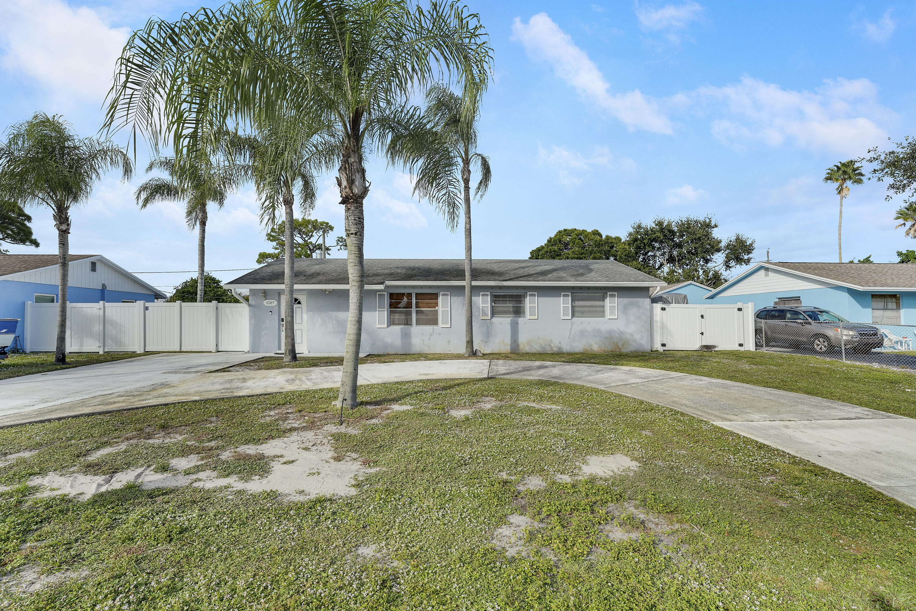 a house with palm tree in front of it