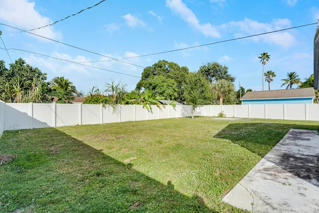 a view of yard with swimming pool