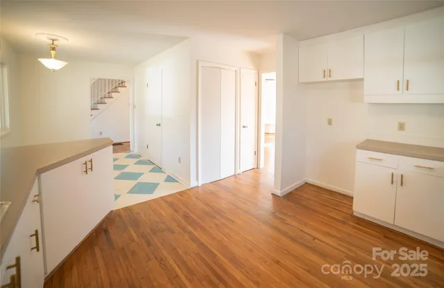 a spacious bathroom with a sink and a mirror